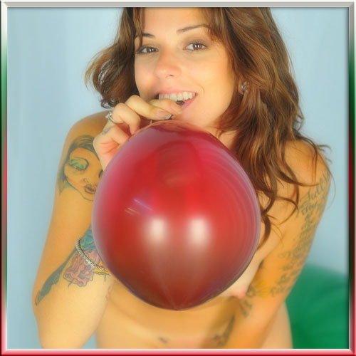 tattoo girl blowing red balloon